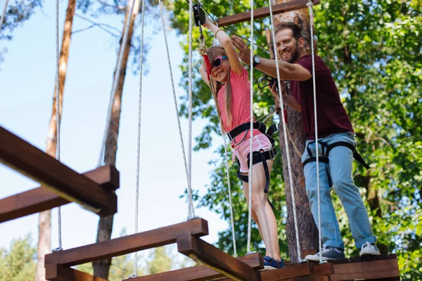 Happy daughter and father having fun at rope park — Stock Photo, Image