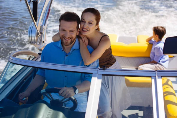 Happy woman spending day on yacht with husband and son — Stock Photo, Image