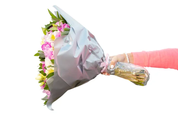 Female hand holding bouquet of flowers horizontally — Stock Photo, Image