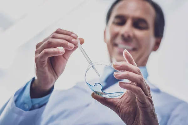 Beaming chemist feeling contended at work — Stock Photo, Image