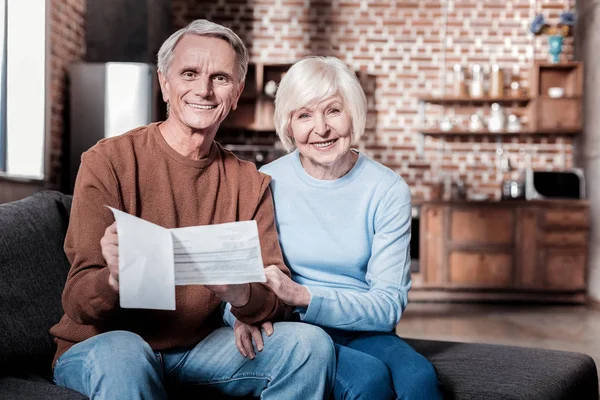 Handsome pensioner keeping documents in hands — Stock Photo, Image