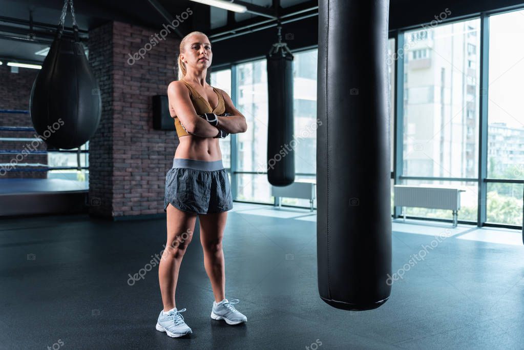 Female boxer training hard before participating in competition