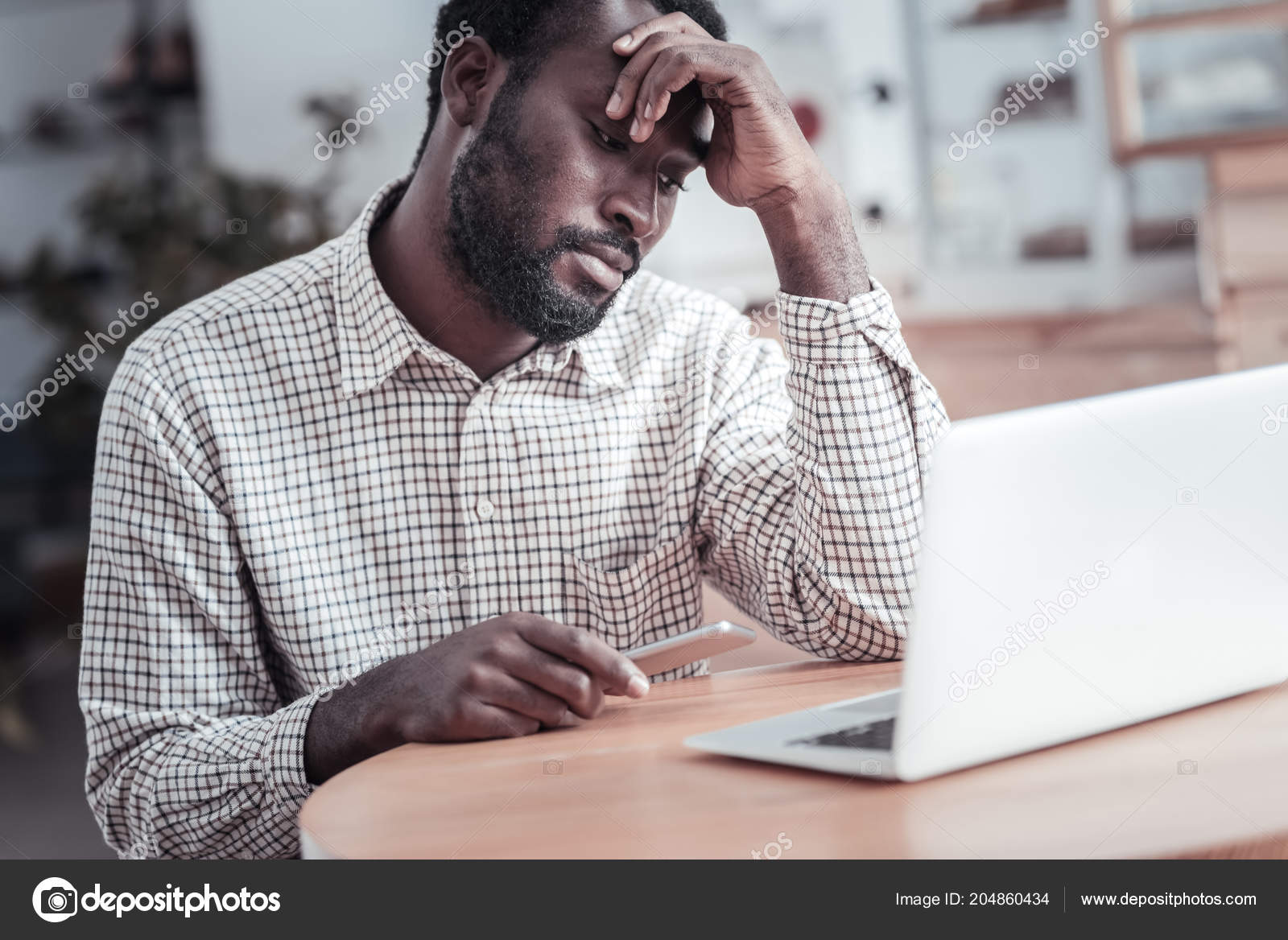 Nice tired man working as a freelancer Stock Photo by ©Dmyrto_Z 204860434