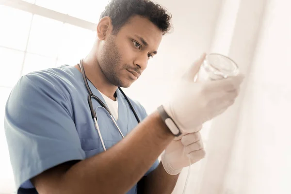 Portrait of serious brunette that preparing dropper — Stock Photo, Image