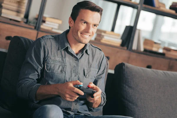 Happy nice man relaxing at home — Stock Photo, Image