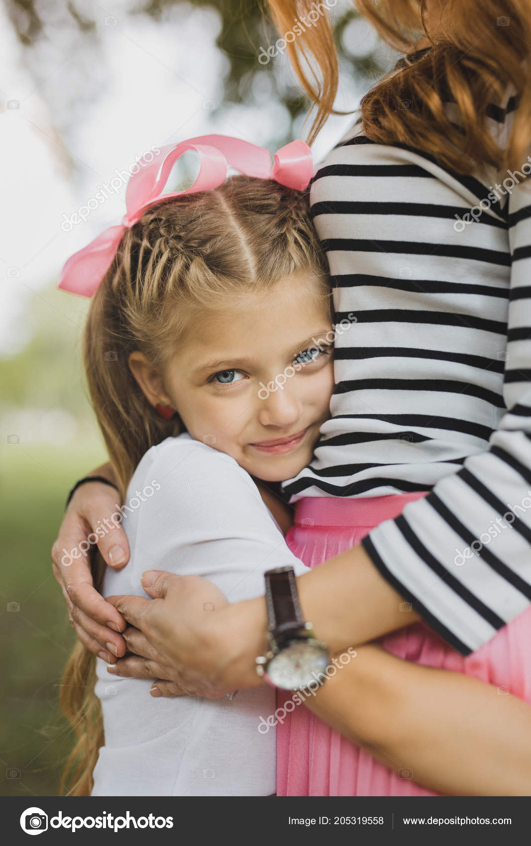 Blonde Haired Blue Eyed Appealing Daughter Hugging Her Parent
