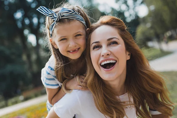 Cute little preschool girl without teeth smiling broadly — Stock Photo, Image