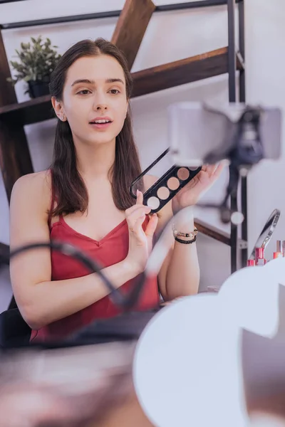 Young student making video about cosmetics for her followers — Stock Photo, Image