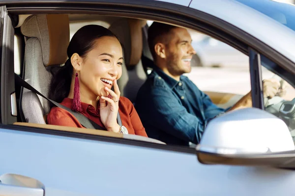 Happy nice woman looking out of the window — Stock Photo, Image