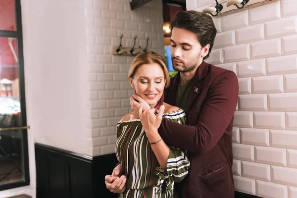 Adorable nice couple leaving restaurant — Stock Photo, Image