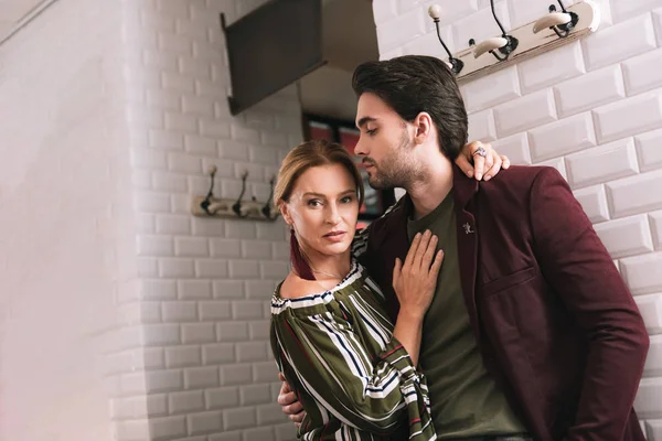 Positive glad couple saying goodbye — Stock Photo, Image