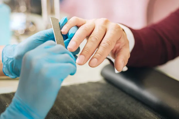 Young female hands using file — Stock Photo, Image