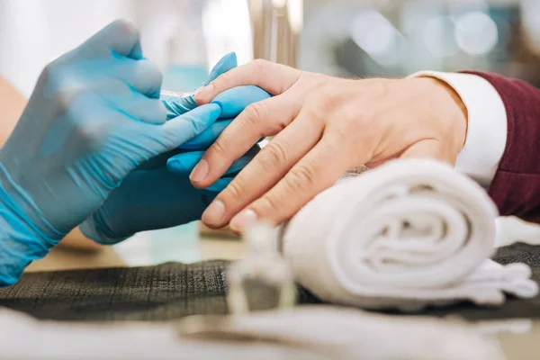 Female hands applying nail polish — Stock Photo, Image