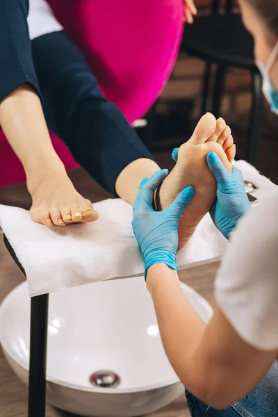 Beauty Service Close Female Hands Pedicuring Foot While Woman Working — Stock Photo, Image