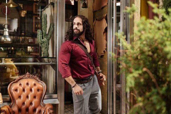 Joyful nice man looking at the interior of the cafe — Stock Photo, Image