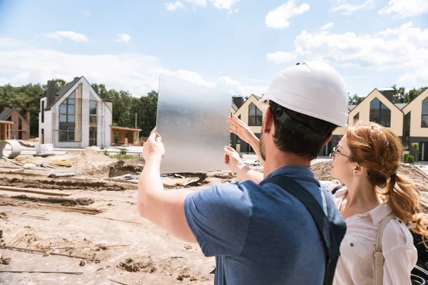Nice smart people standing at the construction site — Stock Photo, Image