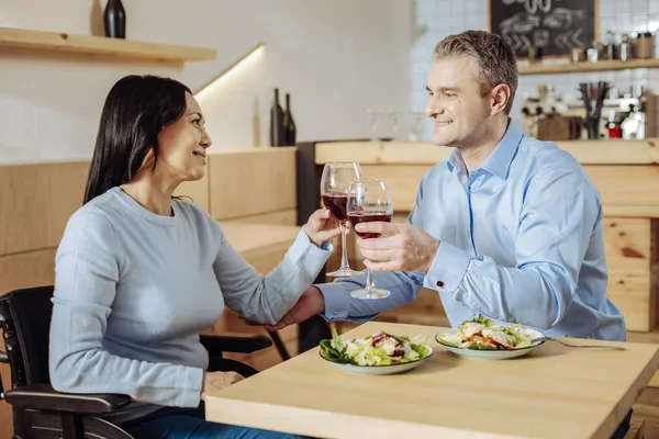 Lovely couple talking while drinking wine — Stock Photo, Image