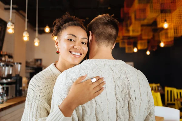 Smiling beaming woman wearing nice ring hugging her husband — Stock Photo, Image