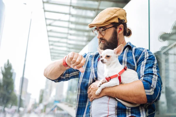 Busy businessman checking the time while running late — Stock Photo, Image