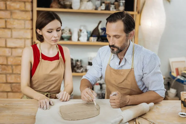 Two creative ceramists having nice ideas in the process of work — Stock Photo, Image