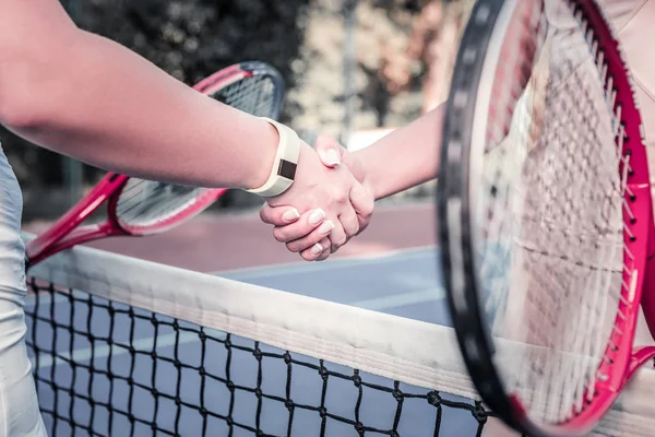 Confident female players jiggling hands before game — Stock Photo, Image