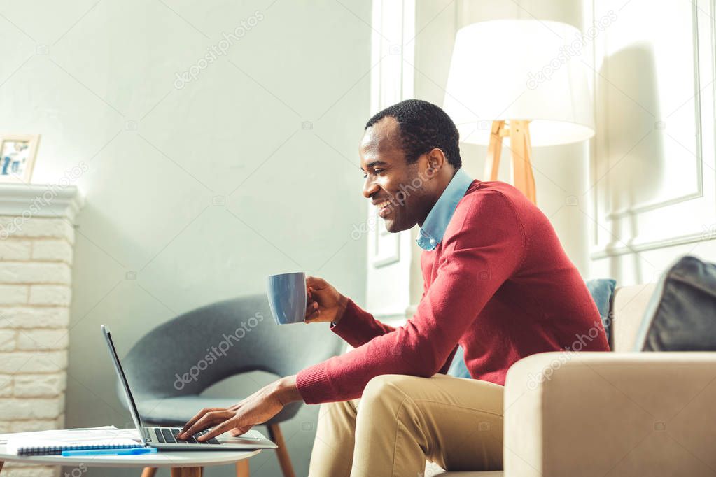 Cheerful young afro american man having meeting