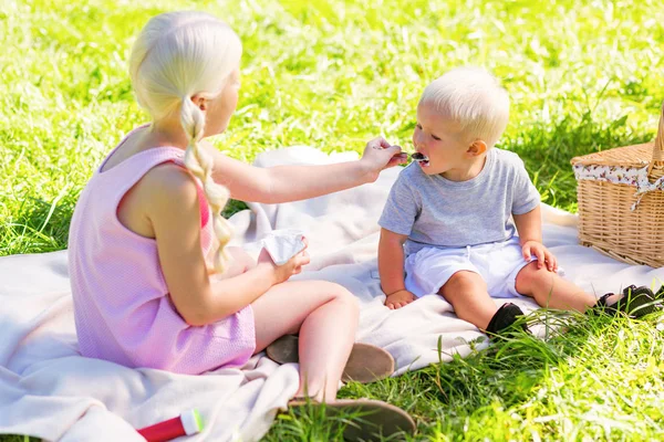 Responsible sister taking care about her small brother — Stock Photo, Image