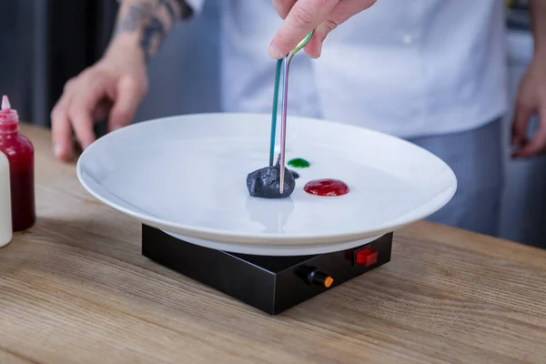 Young cooks trying molecular gastronomy in the kitchen