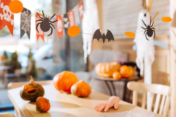 Amazing decorations as painted pumpkins and sweets in the form of scary fingers