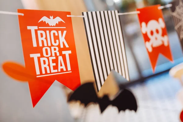 Little bright orange flags with trick or treat sign for Halloween children party