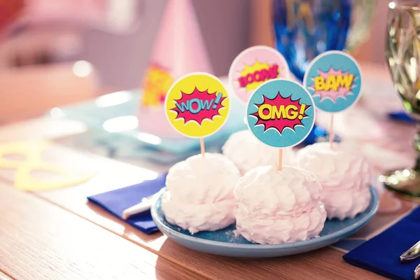 Close up of pink marshmallow decorated with party picks — Stock Photo, Image