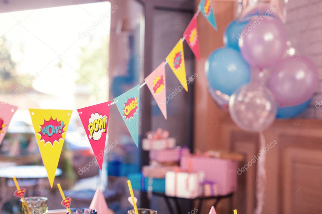 Beautiful photo of colorful party flags placed in the room