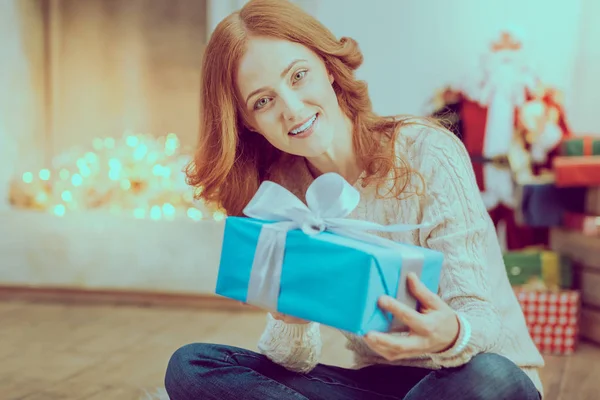 Attractive red haired female holding present — Stock Photo, Image