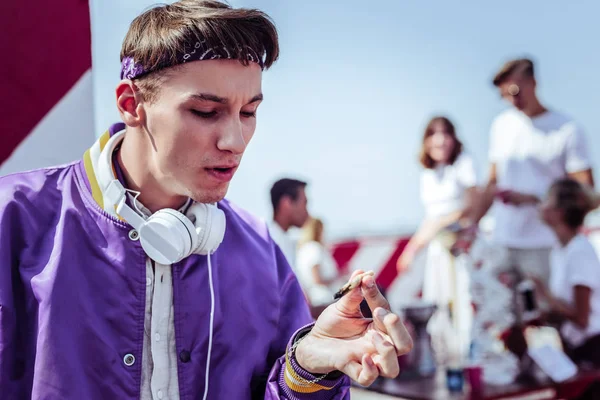 Close up of attentive boy that looking at cannabis — Stock Photo, Image