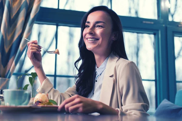 Charming girl keeping smile on her face — Stock Photo, Image