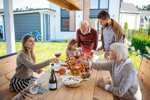 Relaxed females drinking wine in the yard — Stock Photo, Image