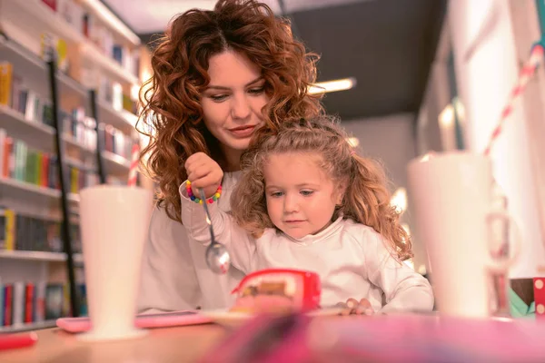 Pretty young mommy visiting cafe with her daughter — Stock Photo, Image