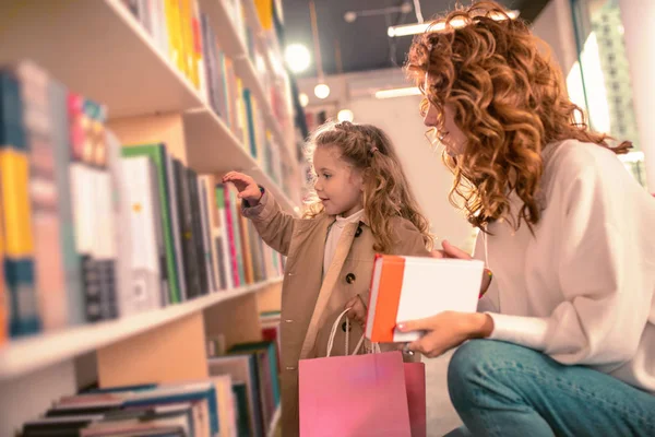 Profile photo of pretty woman that looking at her kid — Stock Image Profile photo of pretty woman that looking at her kid Royalty Free Stock Images