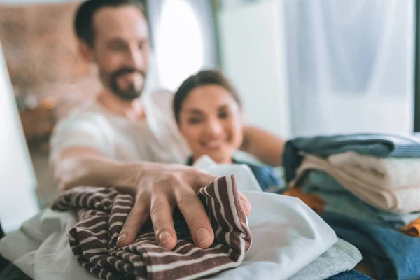 Focused photo on male hand that lying on T-shirt — Stock Photo, Image