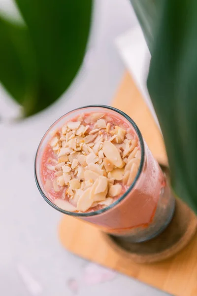 Top view of nutritional fruit smoothie sprinkled with some almond chips — Stock Photo, Image