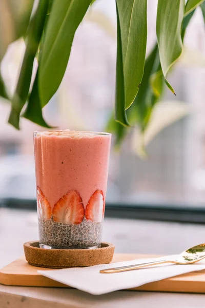 Close up of nutritional breakfast in glass with chia seeds and fruits