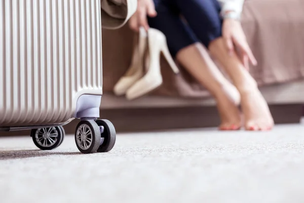 Selective focus of a suitcase standing on the floor