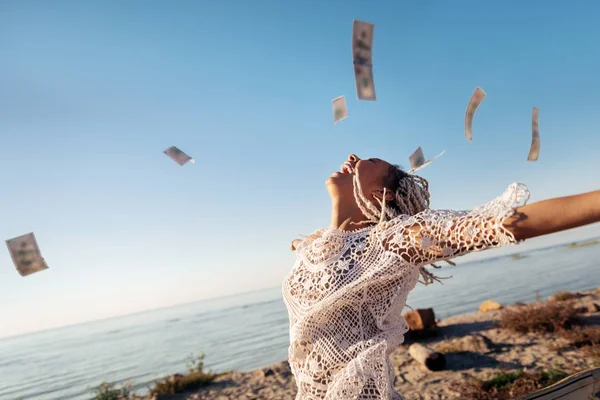 Successful prosperous freelancer throwing her money in the air — Stock Photo, Image