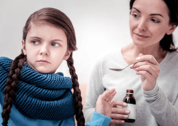 Close up of upset child with cough syrup — Stock Photo, Image