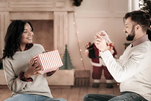 Joyful brunette posing with present — Stock Photo, Image