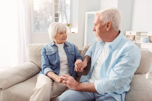 Beautiful aging woman looking at her husband with care — Stock Photo, Image