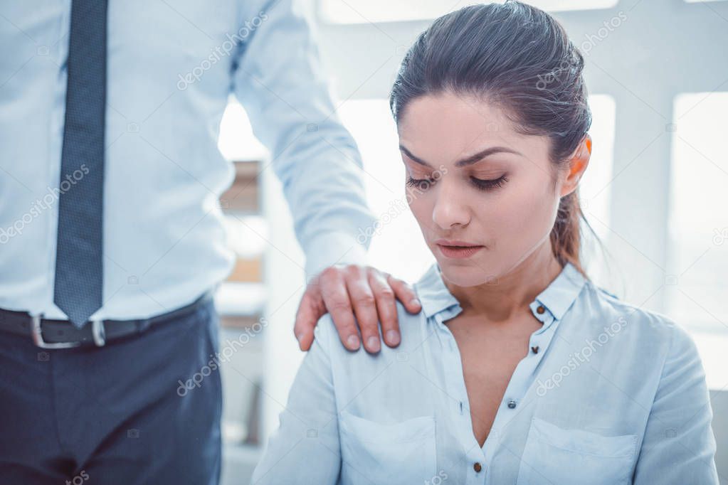 Obscene man in official clothes putting his hand on woman shoulder