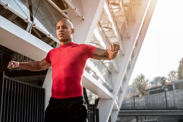 Well built young man doing sports activities