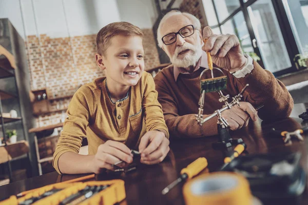 Happy boy dreaming about robot — Stock Photo, Image