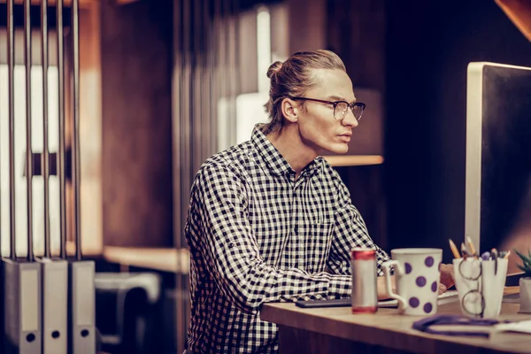 Handsome blonde man staring at his computer — Stock Photo, Image